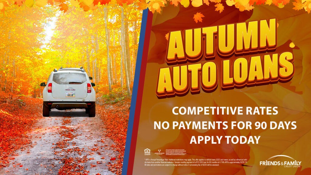 A white car surrounded by fall foliage