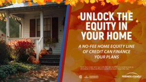 A white house with pumpkins on the porch